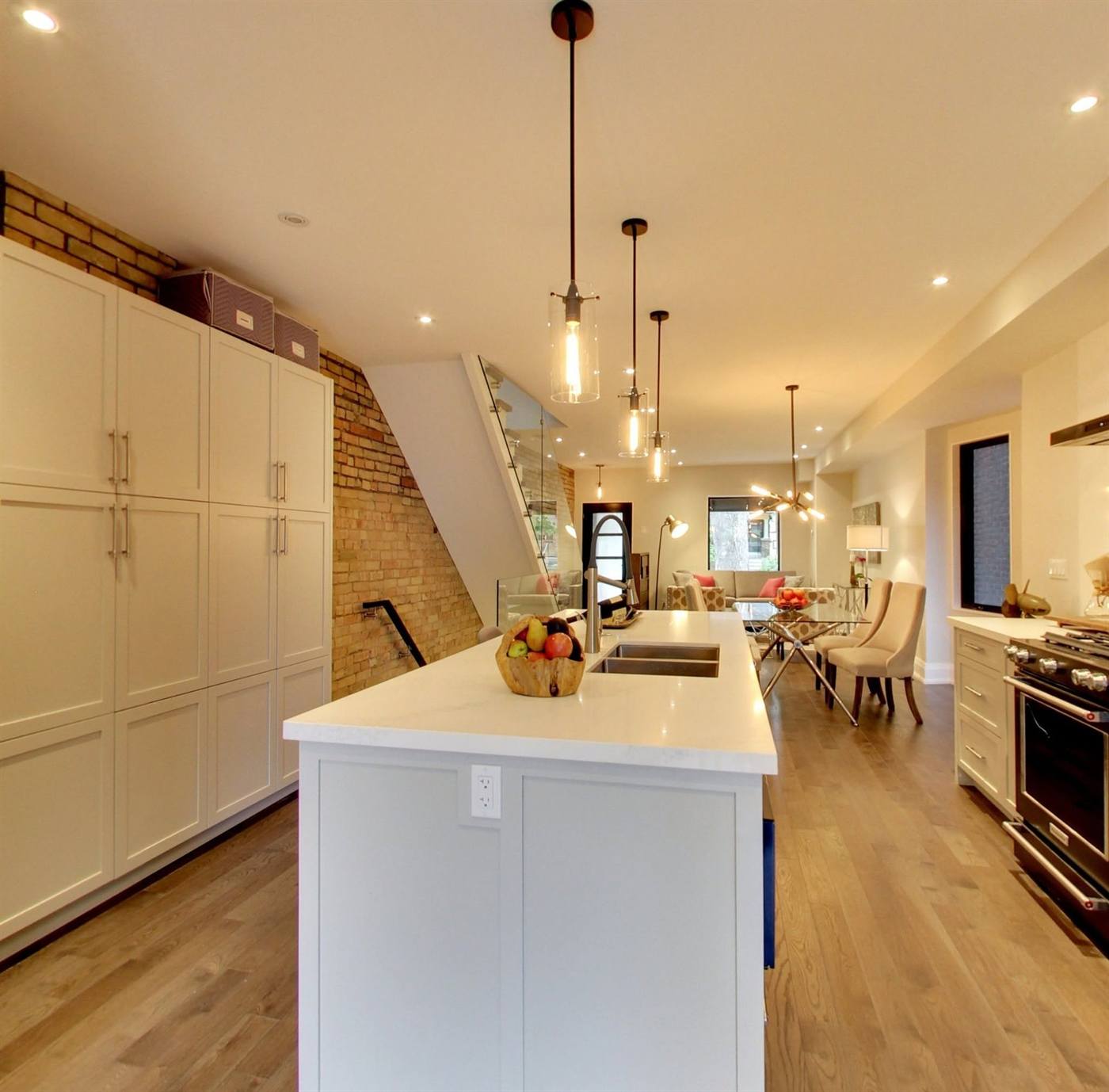 Kitchen island and brick stair wall